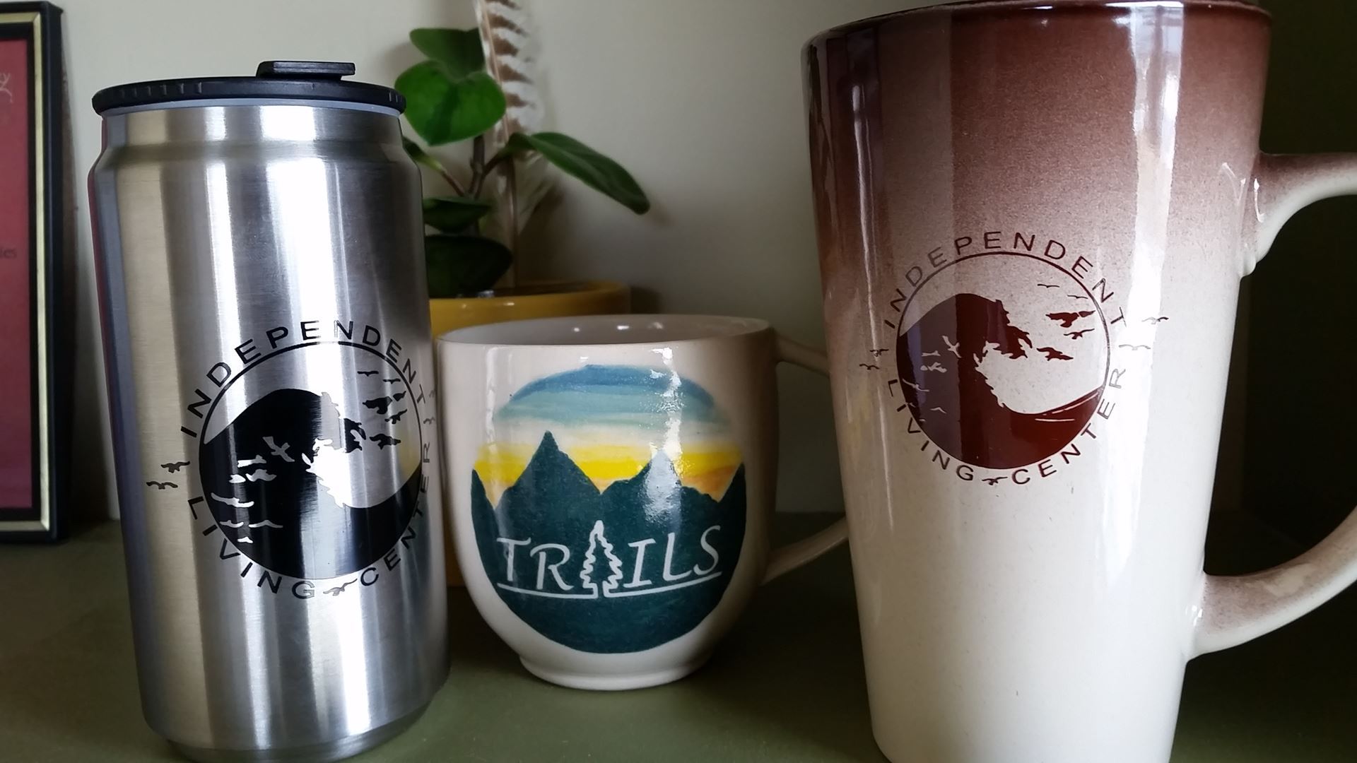 Photo of coffee mugs with ILC and TRAILS logos